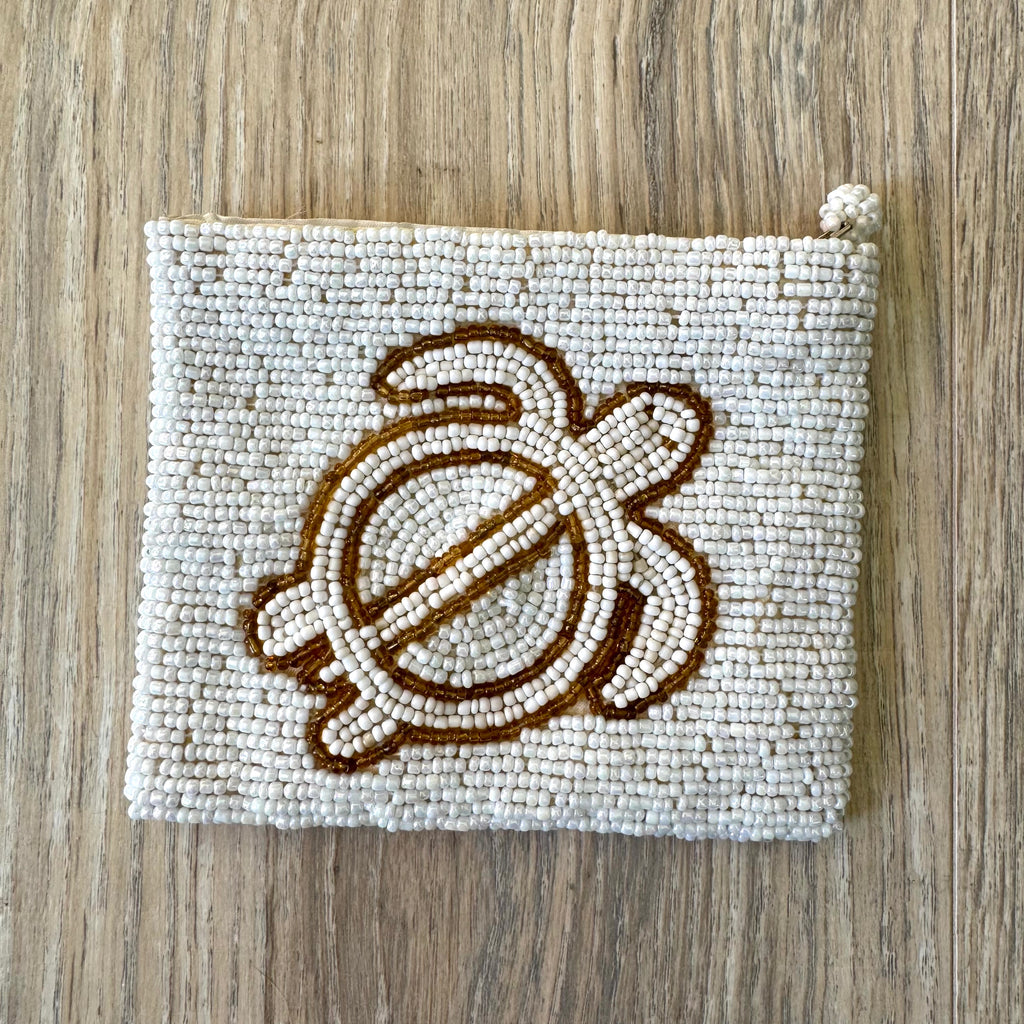 Reverse side of vintage white seed bead coin purse showing full bead coverage and knotted zipper pull