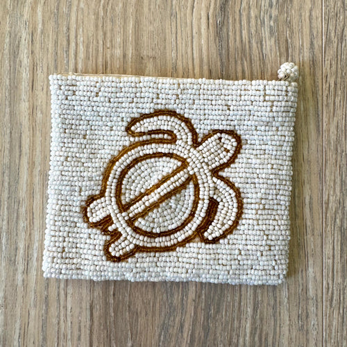 Reverse side of vintage white seed bead coin purse showing full bead coverage and knotted zipper pull