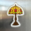 Acrylic magnet featuring a Tiffany-style stained glass lamp with red and pink tulips on a golden yellow background
